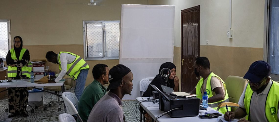 MOGADISHU, SOMALIA - APRIL 23: People have their photos, finger prints and details taken as they are registered to vote in a voting registration run by the National Independent Electoral Boundaries Commission poster on April 23, 2025 in Mogadishu, Somalia. The country launched the first voter registration drive in over 50 years ahead of presidential elections planned for 2026. The country has long used an indirect, clan-based voting system, but its current president has pledged to implement a one-person, one-vote model. (Photo by Ed Ram/Getty Images)